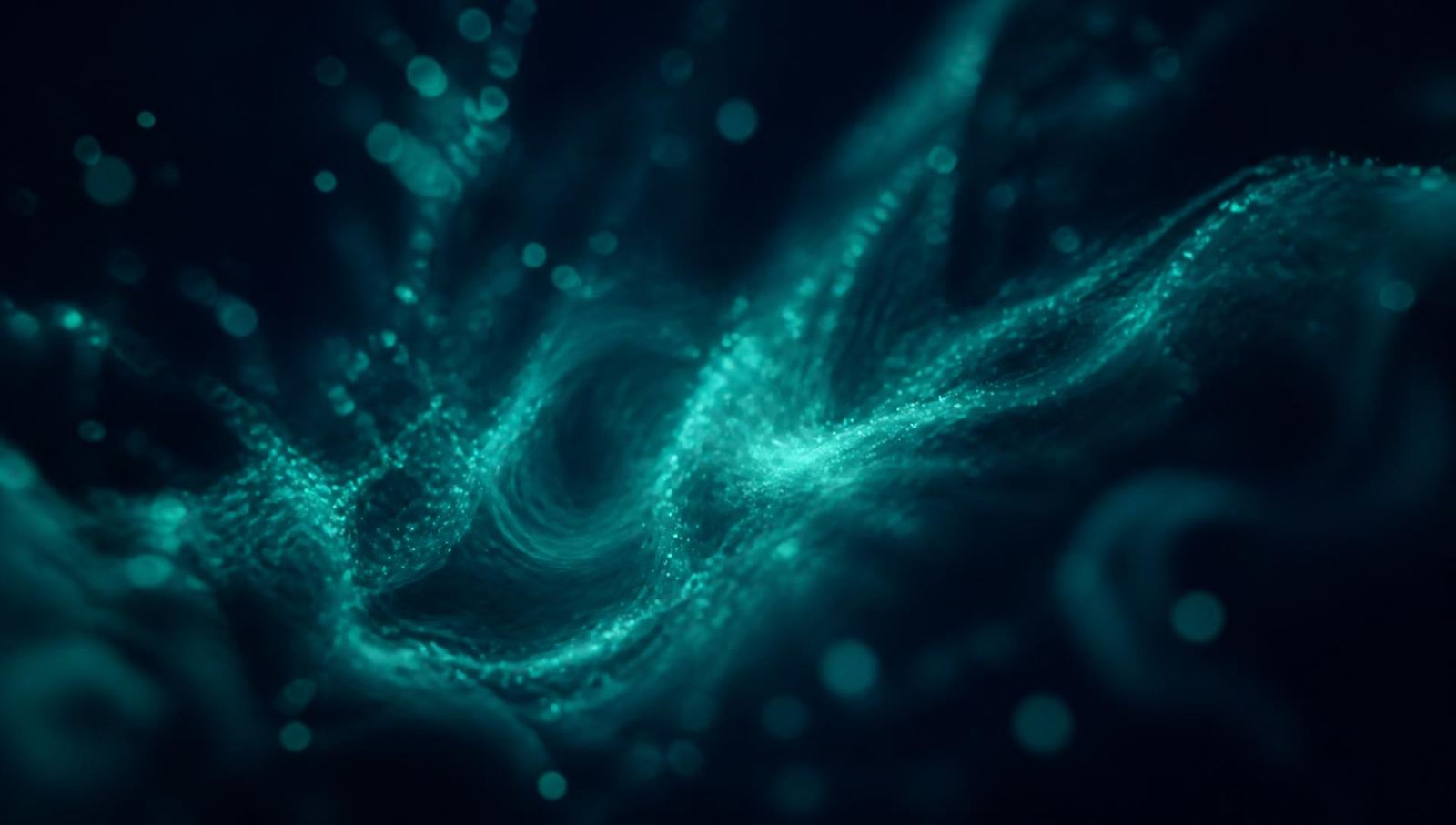Slow-moving mint particles drifting in darkness